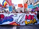 Activists stage a protest in Venice, Italy, denouncing the three-day celebrations for the wedding between Jeff Bezos and his wife Lauren Sanchez Bezos