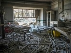 Rescuers search through the rubble of a damaged section of Evin Prison following an Israeli strike. Rescuers search through the rubble of a damaged section of Evin Prison following an Israeli strike.