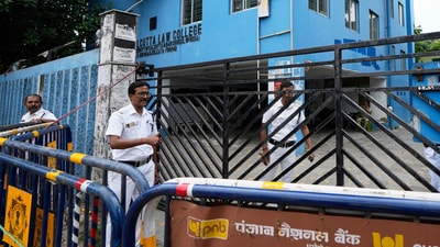 Policemen stand guard outside South Calcutta Law College after the rape of a student on the college campus. (Source: PTI) Policemen stand guard outside South Calcutta Law College after the rape of a student on the college campus. (Source: PTI)