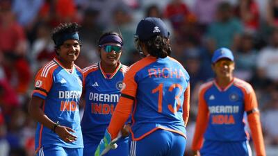 India's Shree Charani (L) celebrates after taking the wicket of England's Nat Sciver-Brunt in the first T20I against England. (Reuters) India's Shree Charani (L) celebrates after taking the wicket of England's Nat Sciver-Brunt in the first T20I against England. (Reuters)
