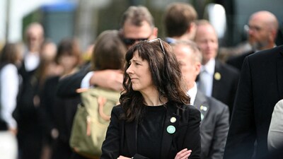 Minnesota State Senator Heather Gustafson waits in line to attend the funeral of slain Minnesota lawmaker Melissa Hortman and her husband Mark, two weeks after they were killed by a man impersonating a police officer, at the Basilica of Saint Mary, in Minneapolis, Minnesota, U.S. June 28, 2025.  REUTERS/Craig Lassig (REUTERS)