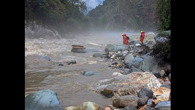 NDRF personnel during a rescue operation in Himachal’s Kullu district on Sunday. (PTI) NDRF personnel during a rescue operation in Himachal’s Kullu district on Sunday. (PTI)