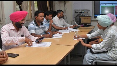 Officials during the first round of counselling for admissions to Class 11 at meritorious schools in Ludhiana. (HT Photo)