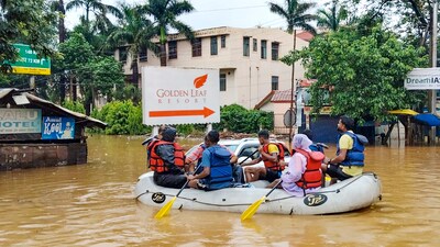 People being shifted to a safer place through a rescue boat amid waterlogging after heavy rainfall, at Jamshedpur, in East Singhbhum district. (PTI)