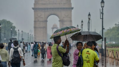 New Delhi: People visit Kartavya Path amid rain, in New Delhi, Sunday, June 29, 2025. (PTI) New Delhi: People visit Kartavya Path amid rain, in New Delhi, Sunday, June 29, 2025. (PTI)