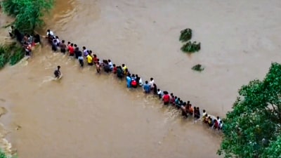 Police rescue students trapped in a residential school after its premises got flooded due to heavy rain, in East Singhbhum district, Jharkhand. (PTI) Police rescue students trapped in a residential school after its premises got flooded due to heavy rain, in East Singhbhum district, Jharkhand. (PTI)