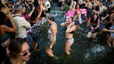 People enjoy into the Washington Square fountain as they take part in the NYC Dyke March during New York’s Pride week LGBTQ+ celebration in New York City, U.S., June 28, 2025. REUTERS/Eduardo Munoz (REUTERS)