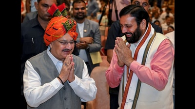 Union minister and BJP national president JP Nadda being greeted by Haryana chief minister Nayab Singh Saini during a ‘Mann Ki Baat’ programme in Gurugram on Sunday. (PTI)