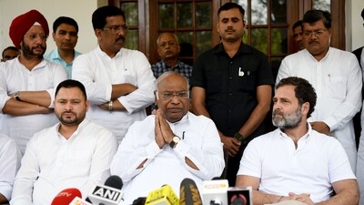 Congress President Mallikarjun Kharge addresses a joint press conference with Bihar Deputy Chief Minister Tejashwi Yadav, party leader Rahul Gandhi and others, at his residence, in New Delhi on Wednesday. (ANI)