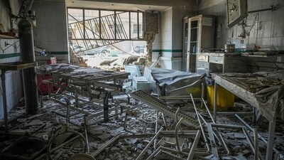 Rescuers search through the rubble of a damaged section of Evin Prison following an Israeli strike (AP) Rescuers search through the rubble of a damaged section of Evin Prison following an Israeli strike (AP)