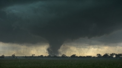 Multiple tornado reports emerged from severe storms in eastern South Dakota and western Minnesota, causing downed trees and power outages for over 50,000 customers. (Representative Image: Unsplash ) Multiple tornado reports emerged from severe storms in eastern South Dakota and western Minnesota, causing downed trees and power outages for over 50,000 customers. (Representative Image: Unsplash )