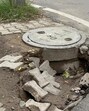 A cave-in near a manhole at Bhai Randhir Singh Nagar in Ludhiana. (HT Photo) A cave-in near a manhole at Bhai Randhir Singh Nagar in Ludhiana. (HT Photo)