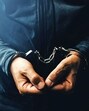 Arrested computer hacker and cyber criminal with handcuffs, close up of hands (Getty Images/iStockphoto) Arrested computer hacker and cyber criminal with handcuffs, close up of hands (Getty Images/iStockphoto)