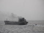 The fire-hit vessel, carrying 14 crew members of Indian-origin, was en route from Kandla, India to Shinas, Oman. The fire-hit vessel, carrying 14 crew members of Indian-origin, was en route from Kandla, India to Shinas, Oman.