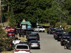 Law enforcement officers gather at Cherry Hill Park after multiple firefighters were attacked when responding to a fire in the Canfield Mountain area outside Coeur d’Alene, Idaho, U.S. June 29, 2025.  
