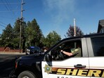 Kootenai County Sheriff's vehicle travels near an area where multiple firefighters were attacked when responding to a fire in the Canfield Mountain area outside Coeur d'Alene, Idaho, U.S. June 29, 2025.  REUTERS/Young Kwak