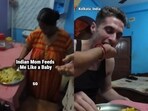 An American vlogger was lovingly fed by an Indian mother in a viral video that left social media users emotional. An American vlogger was lovingly fed by an Indian mother in a viral video that left social media users emotional.