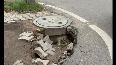 A cave-in near a manhole at Bhai Randhir Singh Nagar in Ludhiana. (HT Photo) A cave-in near a manhole at Bhai Randhir Singh Nagar in Ludhiana. (HT Photo)