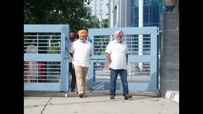 Amritsar businessman Jagjit Singh Chahal and (right) former Akali leader Maninder Singh Aulakh, aka Bittu Aulakh, coming out of the vigilance office in Mohali on Monday. (HT Photo) Amritsar businessman Jagjit Singh Chahal and (right) former Akali leader Maninder Singh Aulakh, aka Bittu Aulakh, coming out of the vigilance office in Mohali on Monday. (HT Photo)
