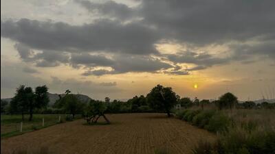 Dark monsoon clouds loom over green fields in Jatoli village on the outskirts of Gurugram on Monday. (Parveen Kumar/HT Photo) Dark monsoon clouds loom over green fields in Jatoli village on the outskirts of Gurugram on Monday. (Parveen Kumar/HT Photo)