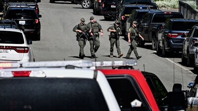 Police and fire crews responded to a deadly shooting and fire on Canfield Mountain near Coeur d'Alene on June 29, 2025. (Kathy Plonka/The Spokesman-Review via AP) (AP) Police and fire crews responded to a deadly shooting and fire on Canfield Mountain near Coeur d'Alene on June 29, 2025. (Kathy Plonka/The Spokesman-Review via AP) (AP)