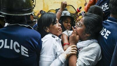 Police personnel detain a member of Akhil Bharatiya Vidyarthi Parishad (ABVP) during a protest against the alleged rape of a student at South Calcutta Law College, in Kolkata, on Monday. (PTI) Police personnel detain a member of Akhil Bharatiya Vidyarthi Parishad (ABVP) during a protest against the alleged rape of a student at South Calcutta Law College, in Kolkata, on Monday. (PTI)