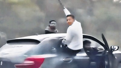 The 15-second clip video purportedly shows stunts being performed on moving cars, with an unidentified man hanging out of a car window, waving a stick, while the driver’s door remains open. (HT Photos) The 15-second clip video purportedly shows stunts being performed on moving cars, with an unidentified man hanging out of a car window, waving a stick, while the driver’s door remains open. (HT Photos)