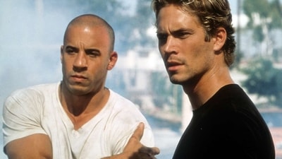 Vin Diesel and Paul Walker in one of the Fast and Furious films. Vin Diesel and Paul Walker in one of the Fast and Furious films.