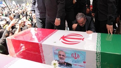 This handout picture provided by the Iranian foreign ministry shows Iran's Foreign Minister Abbas Araghchi mourning next to the coffin of Iranian Revolutionary Guards commander Hossein Salami, who was killed during Israeli strikes. (AFP) This handout picture provided by the Iranian foreign ministry shows Iran's Foreign Minister Abbas Araghchi mourning next to the coffin of Iranian Revolutionary Guards commander Hossein Salami, who was killed during Israeli strikes. (AFP)