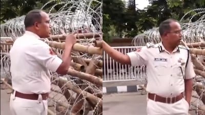 In the viral video, the cop can be heard asking police personnel to "break the legs" of protestors who came near the barbed barricade outside the CM's house. (X) In the viral video, the cop can be heard asking police personnel to "break the legs" of protestors who came near the barbed barricade outside the CM's house. (X)