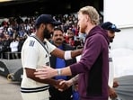 England's Ben Stokes (2nd L) shakes hands with India's Jasprit Bumrah (L)