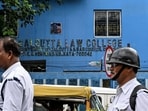 Police personnel walk past the South Calcutta Law College during a protest by law students and junior lawyers against the gang-rape of a student in Kolkata on June 30, 2025. (Photo by Dibyangshu SARKAR / AFP) Police personnel walk past the South Calcutta Law College during a protest by law students and junior lawyers against the gang-rape of a student in Kolkata on June 30, 2025. (Photo by Dibyangshu SARKAR / AFP)