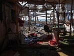 A Palestinian man inspect the damage at Al-Baqa cafeteria which was devastated in an Israeli strike on the Gaza City seafront on June 30.