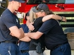 Law enforcement officers gather at Cherry Hill Park after multiple firefighters were attacked when responding to a fire in the Canfield Mountain area outside Coeur d’Alene, Idaho, U.S. June 29, 2025.  REUTERS/Young Kwak