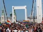People cross the Elisabeth Bridge during the Budapest Pride March in Budapest, Hungary,