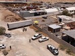A drone view shows authorities working at a crematorium where they found bodies piled up in unsanitary conditions, after local funeral homes hired its services for cremation, according to the Chihuahua State Prosecutor's Office, in Ciudad Juarez, Mexico June 30, 2025. 