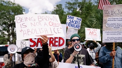 Demonstrators protest the construction of a detention center, nicknamed "Alligator Alcatraz," in the Everglades near Ochopee, Florida, on Tuesday, July 1, 2025.&nbsp; (Bloomberg)