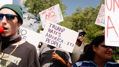 "This is what you need,” Trump said amidst the protest. “A lot of bodyguards and a lot of cops in the form of alligators.” (Bloomberg)