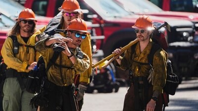 Wildland firefighters with the United States Forest Service prepare at a staging area near the scene the day after a shooter ambushed and killed multiple firefighters responding to a wildfire at Canfield Mountain Monday, June 30, 2025, in Coeur D'Alene, Idaho. (AP Photo/Lindsey Wasson) (AP) Wildland firefighters with the United States Forest Service prepare at a staging area near the scene the day after a shooter ambushed and killed multiple firefighters responding to a wildfire at Canfield Mountain Monday, June 30, 2025, in Coeur D'Alene, Idaho. (AP Photo/Lindsey Wasson) (AP)