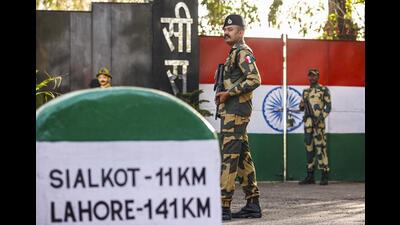 Border Security Force personnel stand guard near the last gate of the India-Pakistan International border at Suchetgarh octroi post on the outskirts of Jammu. (PTI) Border Security Force personnel stand guard near the last gate of the India-Pakistan International border at Suchetgarh octroi post on the outskirts of Jammu. (PTI)