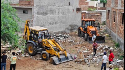 The lavish house of the drug-smuggling couple at Mohalla Mai Jinna being demolished in Jagraon on Tuesday. (HT photo)
