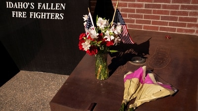 Flowers sit next to memorial at Fallen Heroes Plaza a day after two firefighters were shot dead while responding to a fire and the body of a man was later found with a gun nearby in the Canfield Mountain area outside Coeur d'Alene, in Coeur d'Alene, Idaho, U.S. June 30, 2025.  REUTERS/David Ryder (REUTERS)