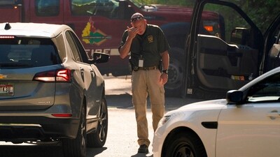 Law enforcement personnel respond near the area where two firefighters were shot dead while responding to a fire and the body of a man was later found with a gun nearby in the Canfield Mountain area outside Coeur d’Alene, Idaho, U.S. June 30, 2025.  REUTERS/David Ryder     TPX IMAGES OF THE DAY (REUTERS)
