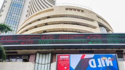 A woman walks past the Bombay Stock Exchange (BSE) building, in Mumbai (PTI/File) A woman walks past the Bombay Stock Exchange (BSE) building, in Mumbai (PTI/File)