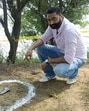 A police official investigating after an encounter with criminals in Moga on Wednesday. (Sanjeev Kumar/Hindustan Times)