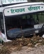 An HRTC bus stuck in the mudslide on road in Mandi district on Tuesday. (HT Photo)
