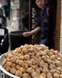 Anarse ki goli is a goli—sphere—embedded with til seeds, and has the size of a chhota rasgulla. (HT) Anarse ki goli is a goli—sphere—embedded with til seeds, and has the size of a chhota rasgulla. (HT)
