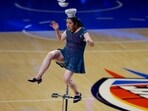 Rong Niu, known as Red Panda, suffers an injury during the halftime show. Mandatory Credit: Alonzo Adams-Imagn Images