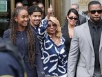 Janice Combs and Chance Combs walk outside the U.S. federal court, after the jury reached verdicts in the Sean 