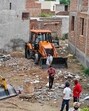The lavish house of the drug-smuggling couple at Mohalla Mai Jinna being demolished in Jagraon on Tuesday. (HT photo) The lavish house of the drug-smuggling couple at Mohalla Mai Jinna being demolished in Jagraon on Tuesday. (HT photo)